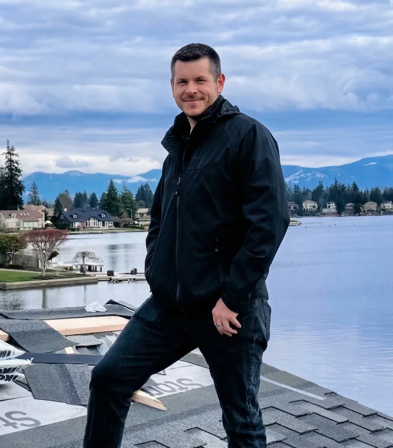 Peter Luyet, owner of PNP Exteriors, on a rooftop at Lake Tapps, Washington